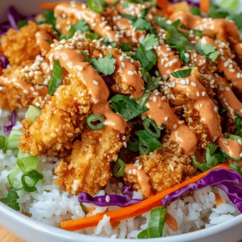 Are you ready to elevate your weeknight dinners with a dish that tantalizes your taste buds and impresses your family? The Bang Bang Chicken Bowl is a culinary wonder that combines crispy chicken, vibrant fresh vegetables, and a zesty sauce, creating a meal that is both satisfying and bursting with flavor. This dish is not only a feast for the palate but also a feast for the eyes, with its colorful array of ingredients that come together to create a beautiful bowl of goodness.