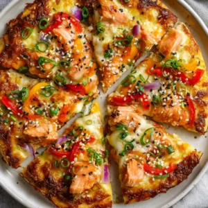 Salmon Teriyaki Delight Pizza offers a unique culinary experience that beautifully marries Italian pizza with classic Japanese teriyaki flavors. This dish creates a delightful contrast on the palate, merging tender, flaky salmon with the savory-sweetness of teriyaki sauce. No longer confined to standalone sushi rolls or straightforward seafood dishes, salmon elevates pizza to something truly special.