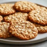 Oatmeal cookies are a beloved classic in the world of baking, cherished for their chewy texture and wholesome ingredients. They occupy a unique spot in our hearts as a nostalgic treat, often evoking memories of home baking and cozy afternoons. What makes these Honey Oatmeal Cookies particularly special is their inclusion of honey, which not only sweetens but also enriches the overall flavor profile and texture, lending these cookies a delightful note that sets them apart from traditional recipes.