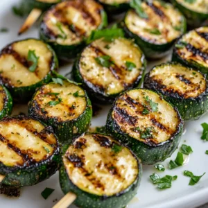 Garlic butter zucchini skewers are a delicious and vibrant dish that elevates the humble zucchini into a flavorful offering. This recipe harnesses the power of fresh ingredients, especially zucchini, which shines when grilled. The buttery garlic marinade infuses the zucchini with savory depth, making it a standout side dish or appetizer that captures the essence of summer grilling. Whether served at a barbecue with friends or as part of a cozy family dinner, these skewers bring joy to the table.