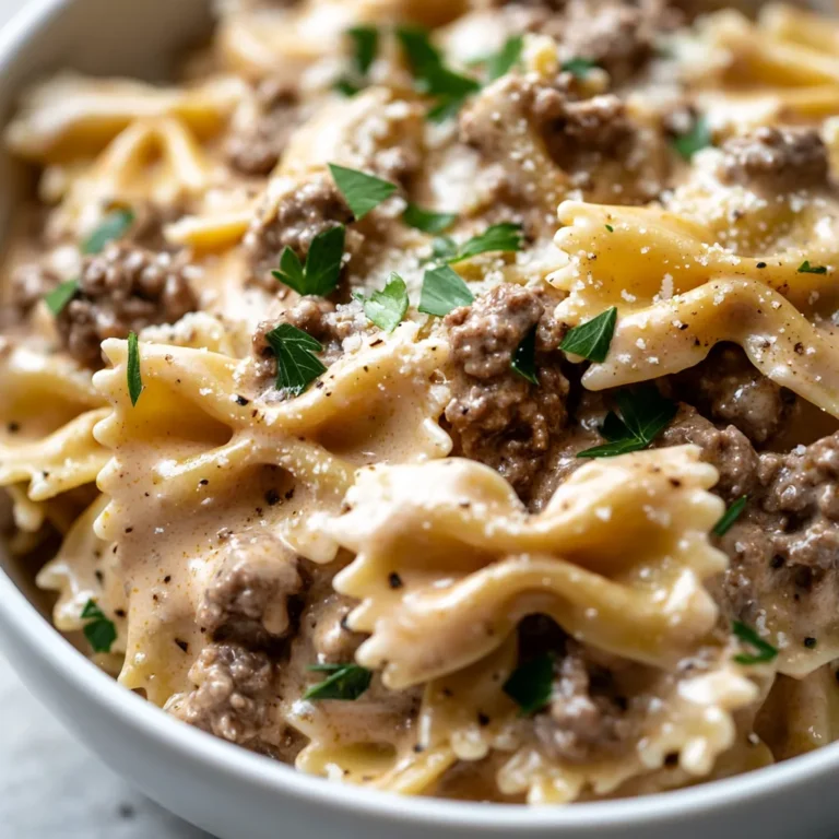 Creamy Parmesan Garlic Beef Bowtie Pasta Delight is a dish that perfectly balances richness and simplicity, making it an ideal choice for weeknight dinners or cozy gatherings. This pasta dish combines tender bowtie pasta with savory ground beef, a luscious cream sauce, and robust garlic flavors, creating a comforting meal in under 30 minutes. The beauty of this recipe lies in its ability to convert simple ingredients into a delectable main course that appeals to both children and adults alike.