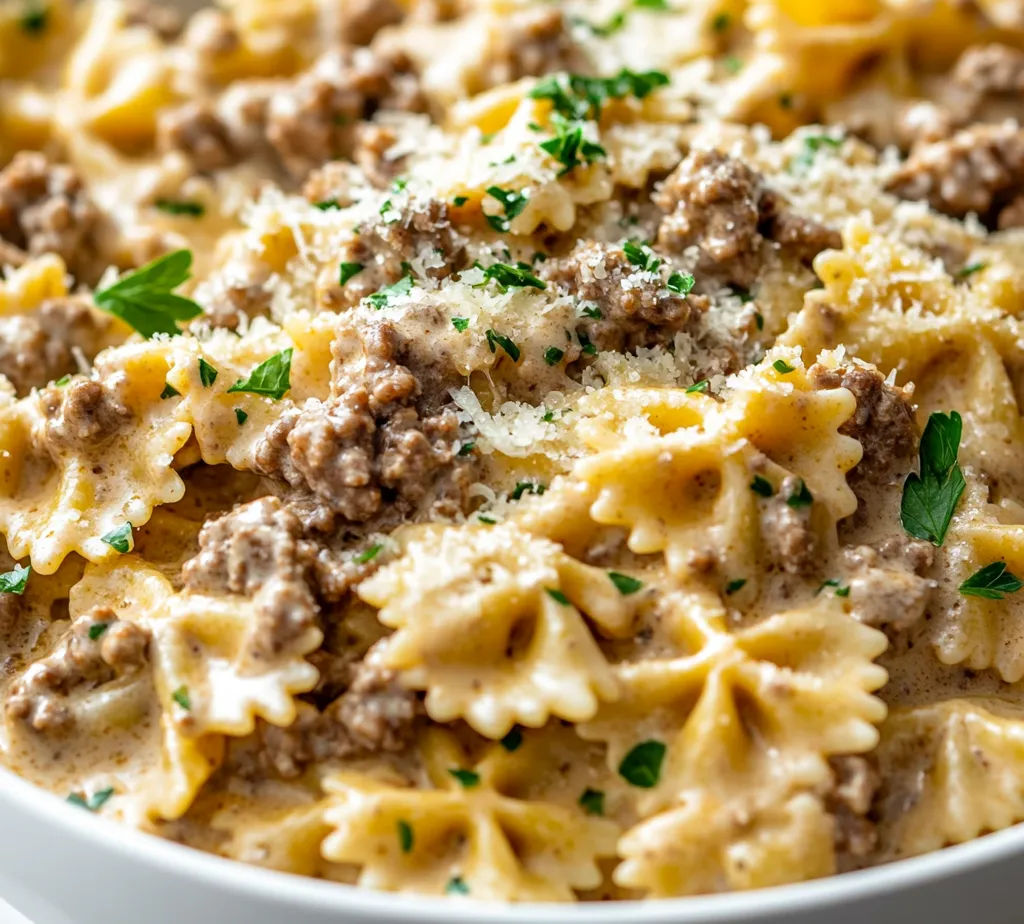 Creamy Parmesan Garlic Beef Bowtie Pasta Delight is a dish that perfectly balances richness and simplicity, making it an ideal choice for weeknight dinners or cozy gatherings. This pasta dish combines tender bowtie pasta with savory ground beef, a luscious cream sauce, and robust garlic flavors, creating a comforting meal in under 30 minutes. The beauty of this recipe lies in its ability to convert simple ingredients into a delectable main course that appeals to both children and adults alike.