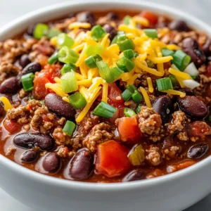 Rustic Cowboy Chili is more than just a dish; it's a testament to hearty home cooking steeped in cultural significance. As a staple in many American households, particularly in the Southwestern region, this chili embodies the essence of comfort food. The roots of cowboy chili trace back to the rugged cowboys of the American frontier, who relied on simple, nourishing ingredients that were easy to prepare over an open flame. This dish not only evokes the spirit of the wild West but also brings together friends and family around the dinner table, encapsulating warmth and community.
