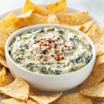 Cheesy Spinach and Artichoke Delight Dip is a classic American appetizer that brings a burst of flavor and warmth to any gathering. Known for its creamy texture and rich taste, this dip is not just a palate pleaser, but also an easy-to-make dish that is perfect for entertaining. Whether you are hosting a party, a game day, or a casual family get-together, this dip promises to be a hit. The combination of fresh spinach, tender artichoke hearts, and a medley of creamy cheeses creates a delightful dish that is sure to impress your guests and satisfy their cravings.